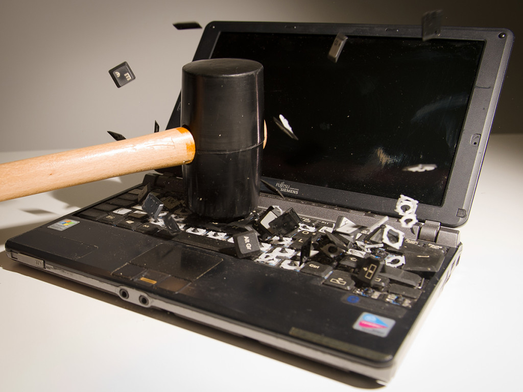 This picture taken in London on May 9, 2013 is a posed image of a laptop computer's keyboard shattering into pieces after an impact.  AFP PHOTO/Leon Neal        (Photo credit should read LEON NEAL/AFP/Getty Images)