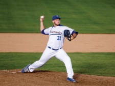 Pitcher Joie Dunyon (#31) throwing a strikout against Hawaii.