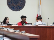 President Pro Tempore Corey Willis and Parlimentarian Bryan Martinez talking.