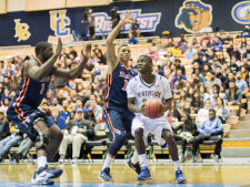 Malik Thames (No. 22) uses his body to keep the ball away from his opponents.
