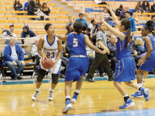 Brittany Crain (No. 23) eyes the basket before attempting a shot.