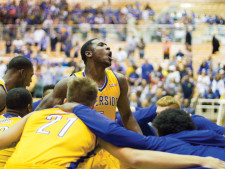 Taylor Johns (No. 5) leads the team during their cheer.