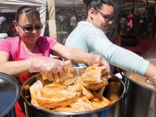 Festival participants prepping their tamales to be served