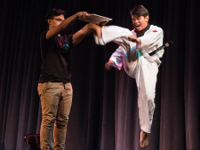 Martin Arceo demonstrates his black belt in taekwondo with a high kick.