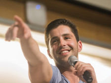 Josh Pecks points at one of his fans.