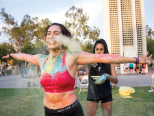 Students tagging themselves in different colors through dusts and paints