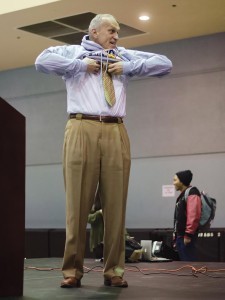 Before anyone else, Chancellor Wilcox is the first to try on his UCR sweater.