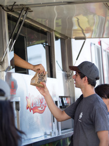A student grabs his free Carl Jr’s meal.